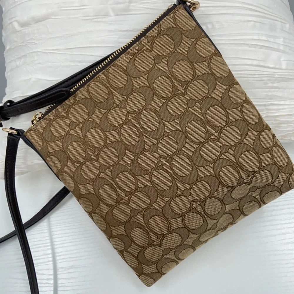 NEW Coach Bag Signature Canvas North South Swing pack 52576‎